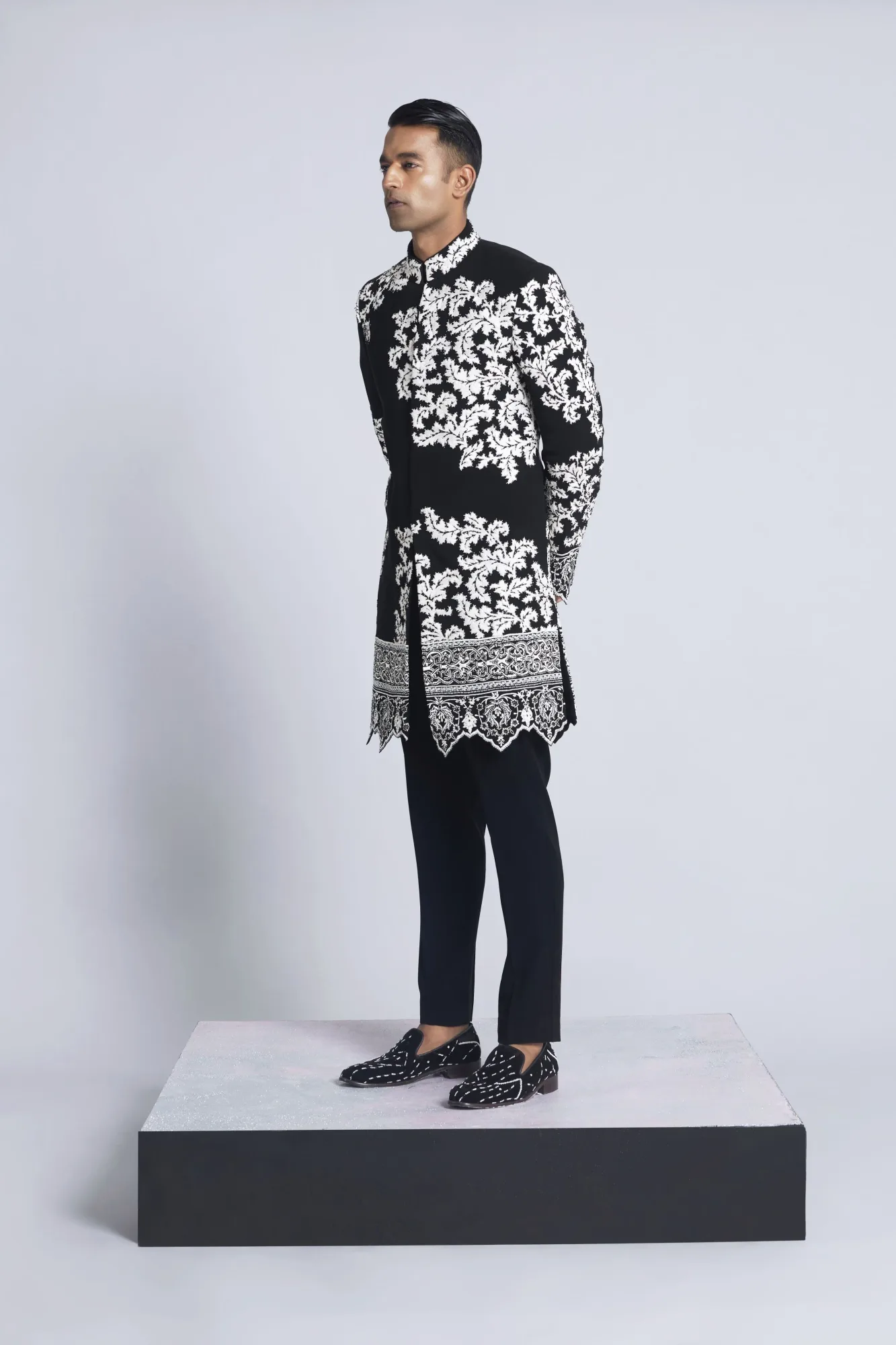 Black sandwash with white detailing indo western set by Sarab Khanijou