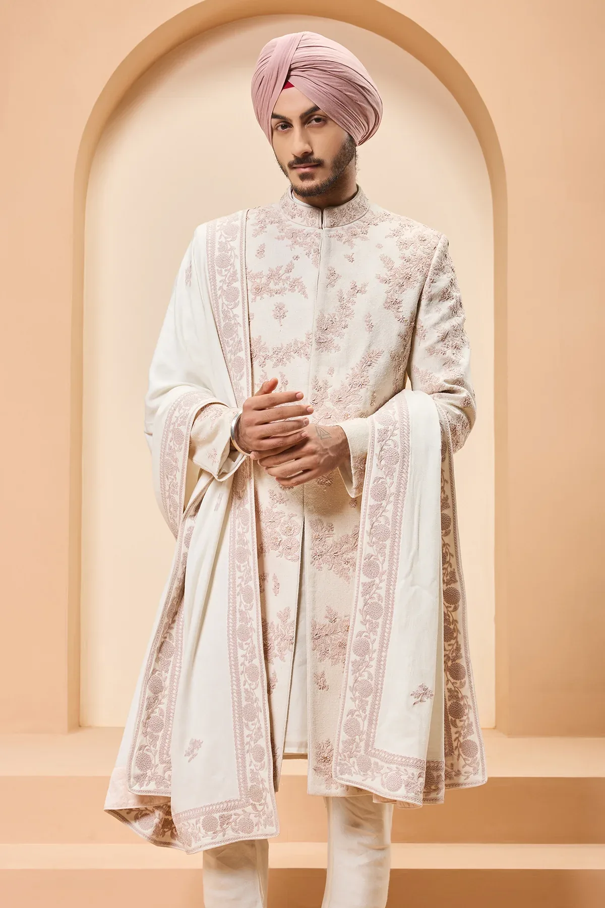 Ivory sherwani detailing with pearl sequins and thread work by Sarab Khanijou