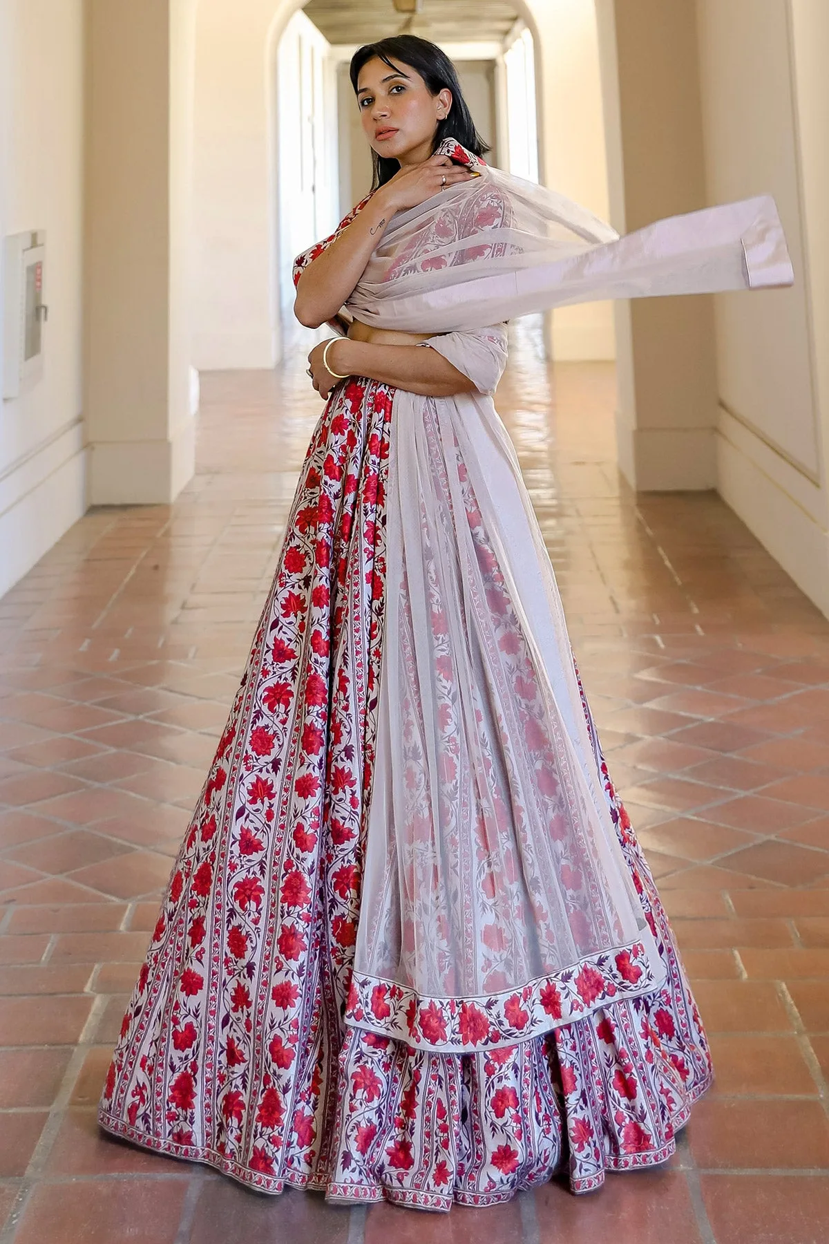 Navdeep kaur in Charmaine by Ridhi Mehra, red lehenga
