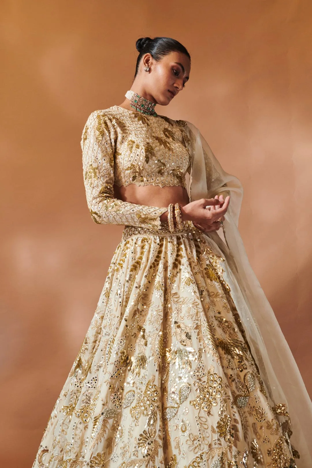 Ivory And Gold Heavily Embroidered Lehenga by Tamanna Punjabi Kapoor, view 3