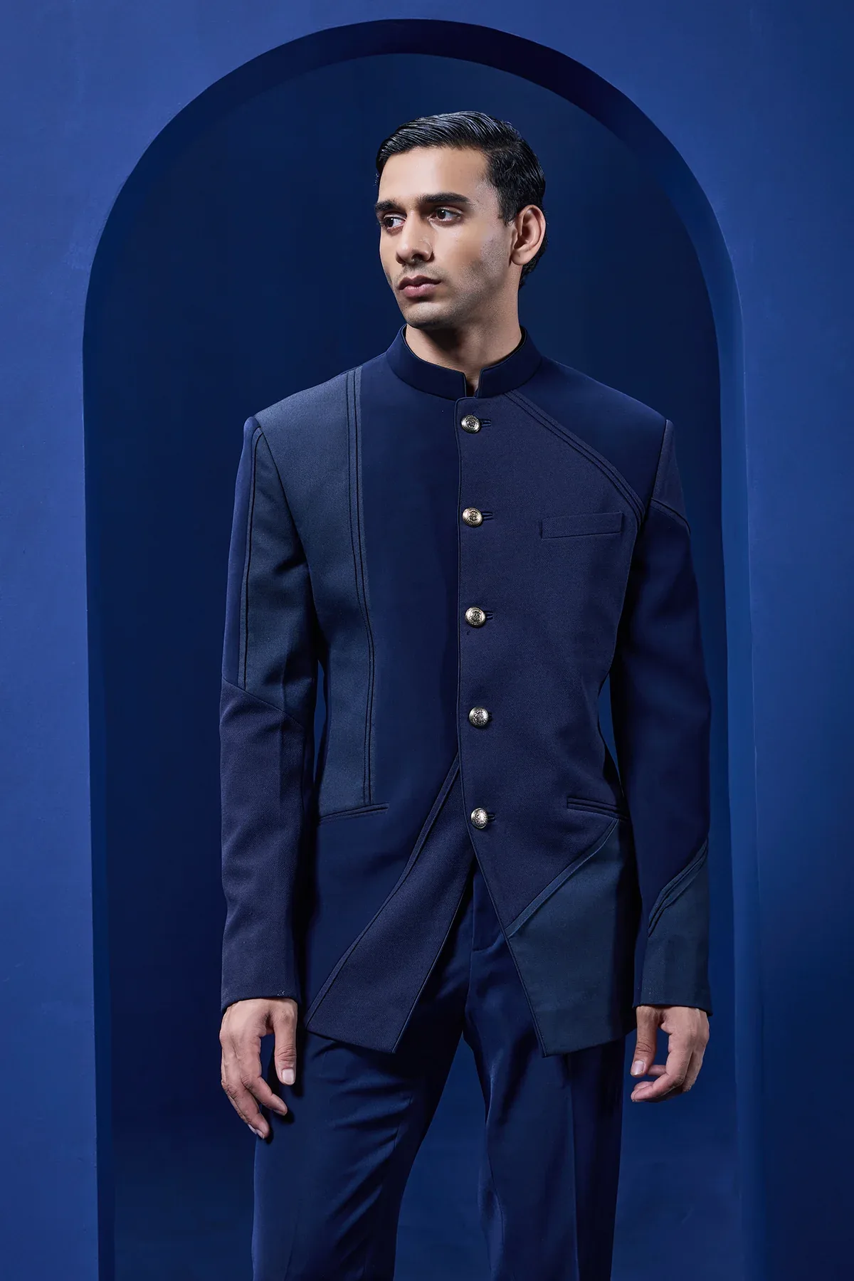 Navy blue bandhgala detailing with golden button by Sarab Khanijou