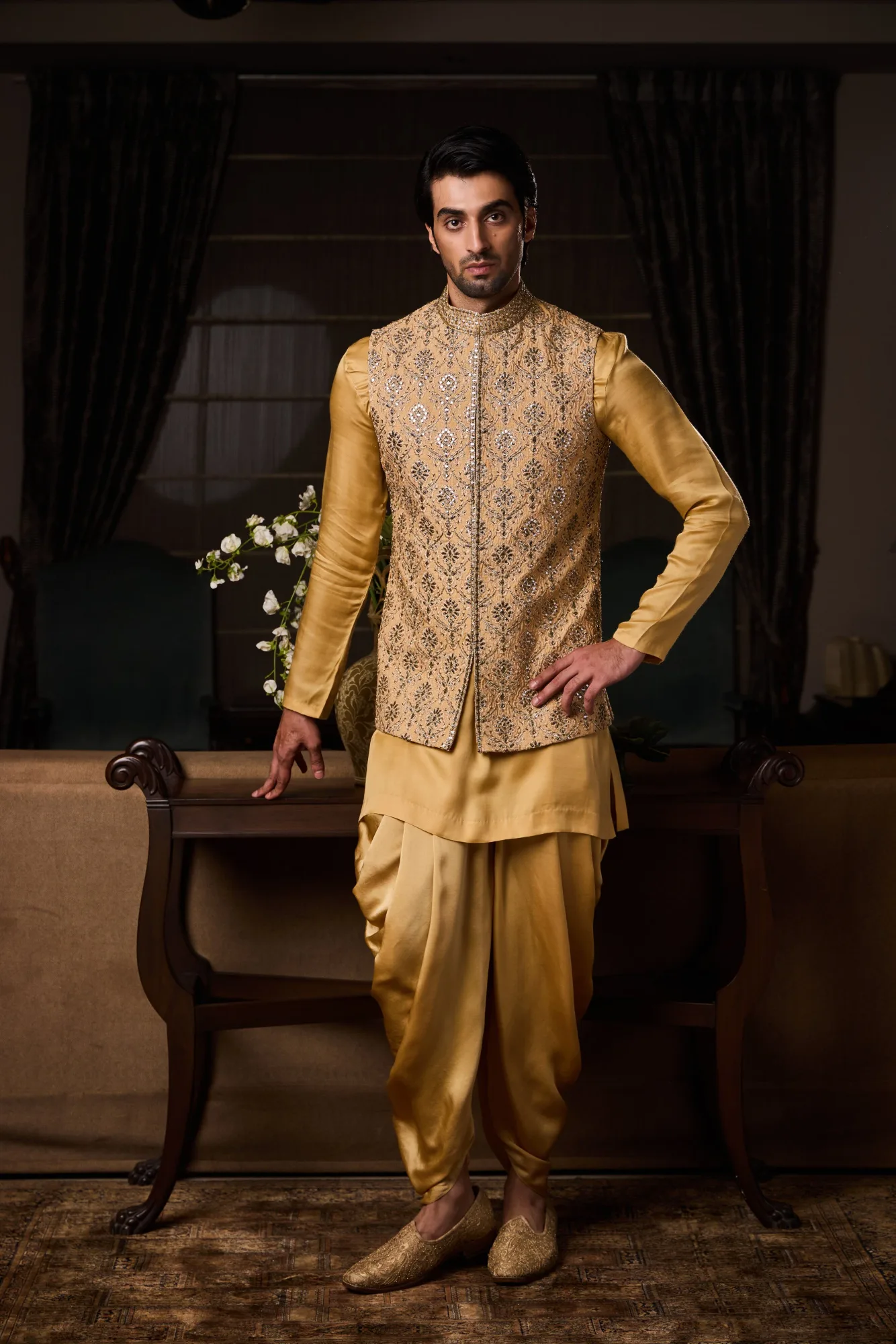 Gold Bundi Jacket Beige Kurta Churidar Set by Nitika Gujral