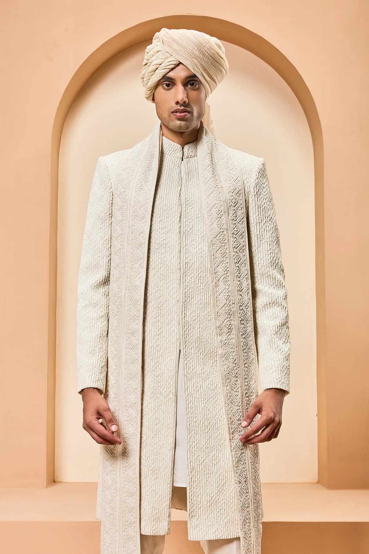Ivory sherwani detailing with pearl cutdana and pintex work by Sarab Khanijou