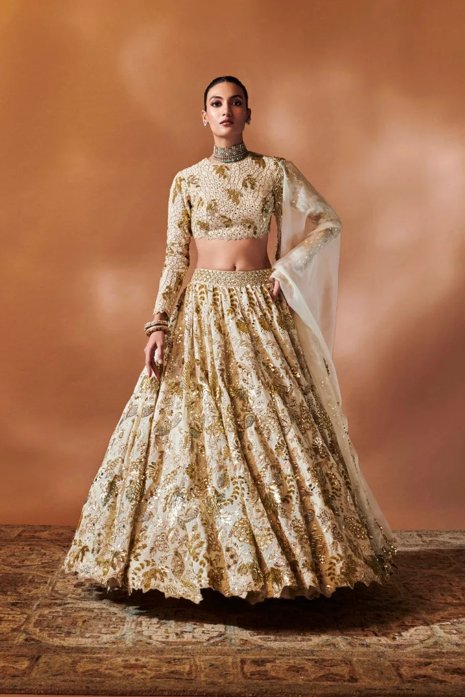 Ivory And Gold Heavily Embroidered Lehenga by Tamanna Punjabi Kapoor