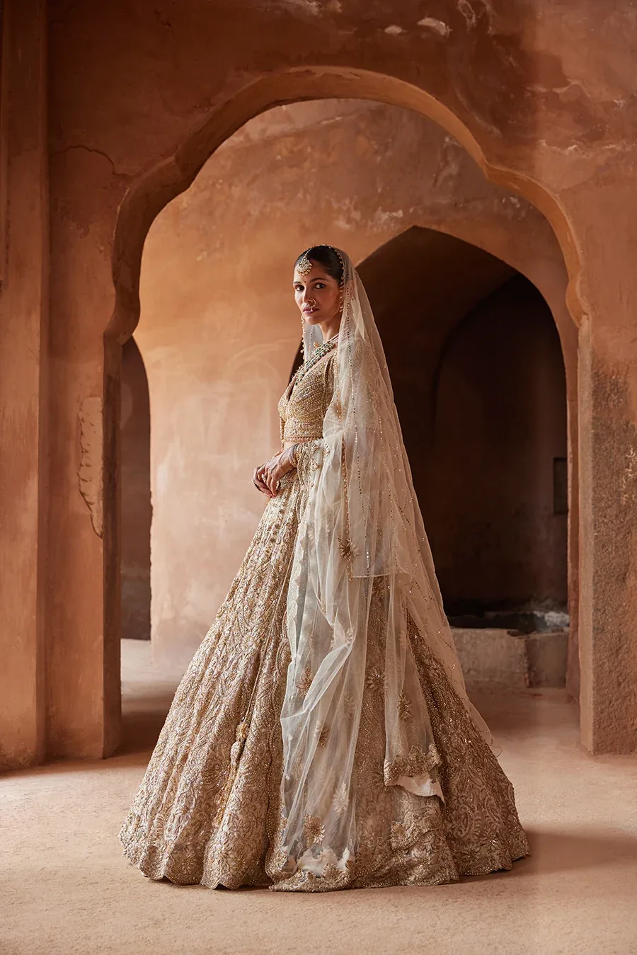 Champagne Noor Lehenga by Nitika Gujral