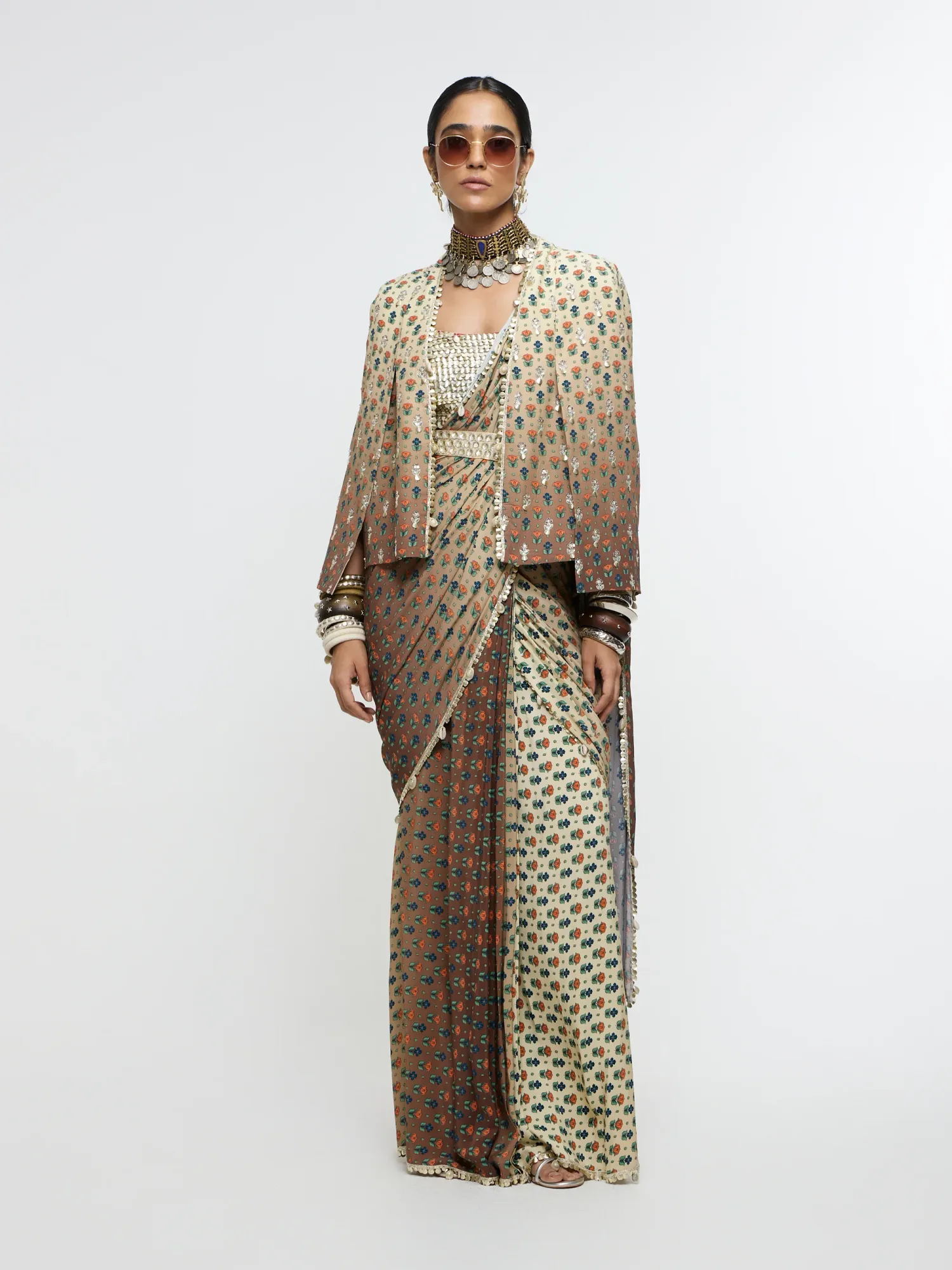 Mahnoor Cape Jacket Paired with Metallic Bustier & Drape Saree by SVA