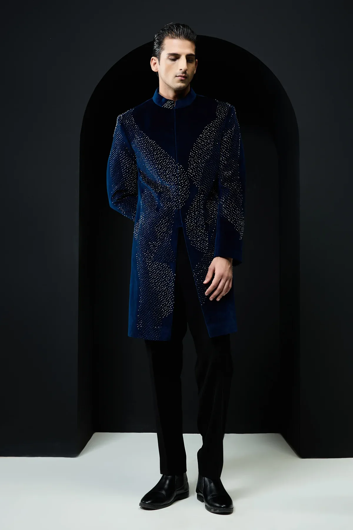 Teal blue Indo Western highlighted with sequins and pearls by Sarab Khanijou