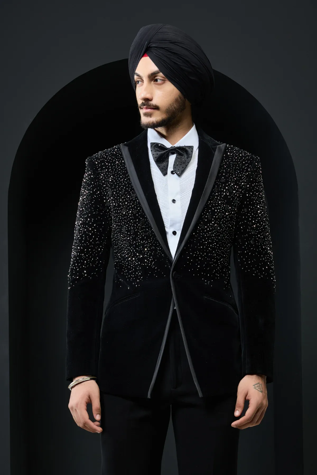 Black tuxedo highlighted with pearls and crystal by Sarab Khanijou