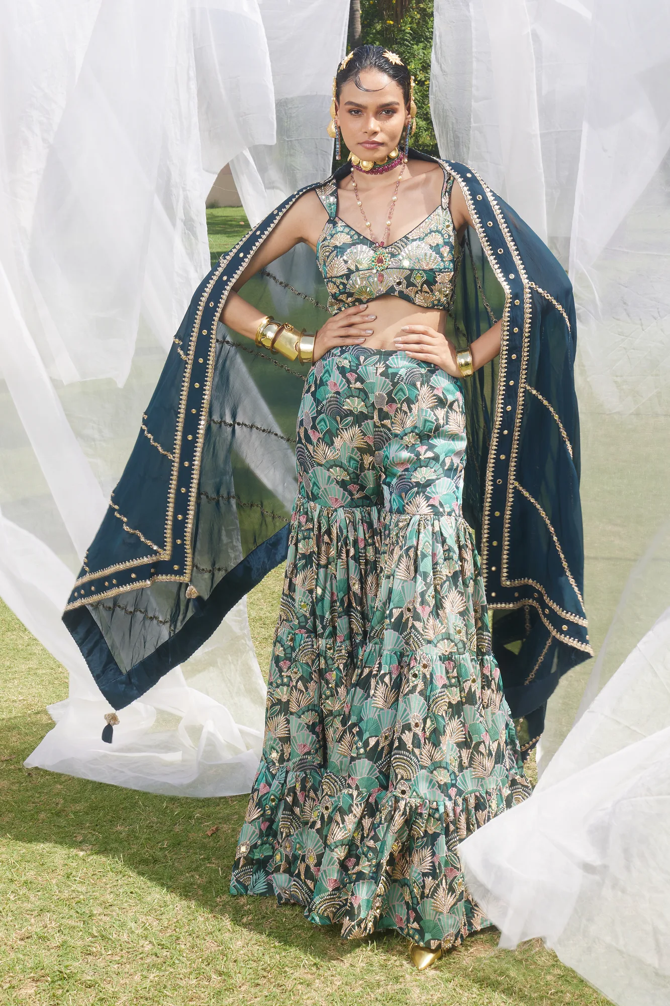 Gloria Lehenga Set by Paulmi And Harsh in antique gold