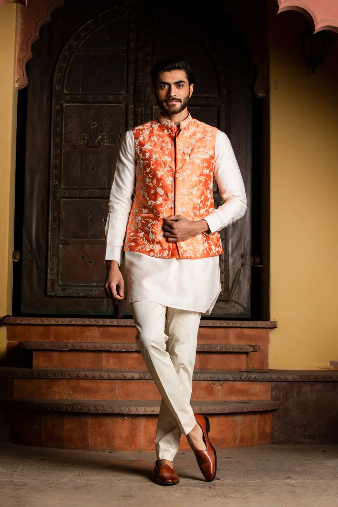 Orange Raw Silk Embroidered Nehru Jacket with Kurta & Pant by Nitika Gujral