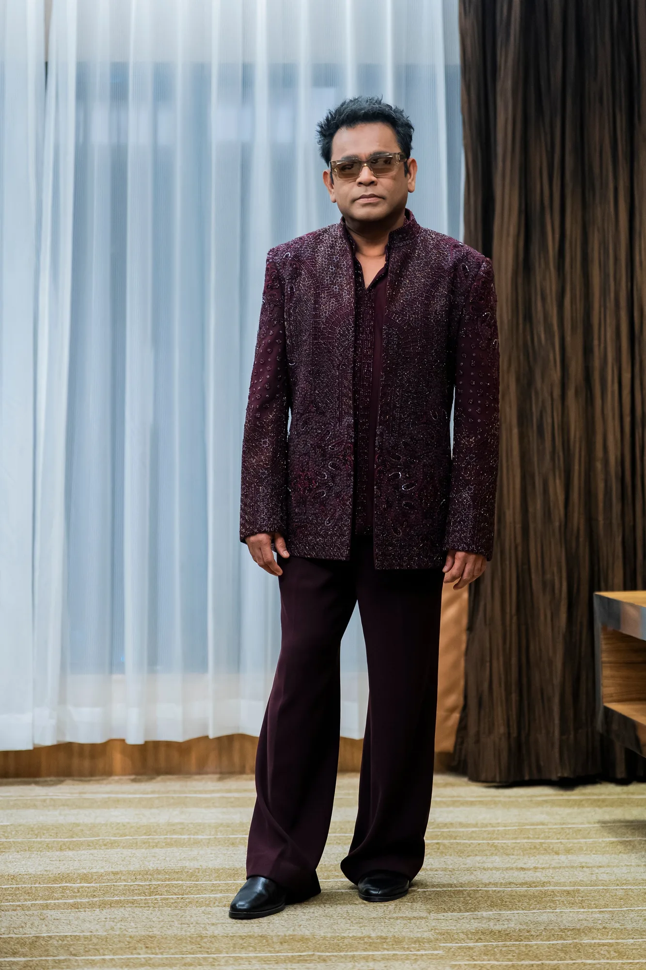 AR Rahman in Mirage Open Jacket Set by Dolly J in burgundy, view 2