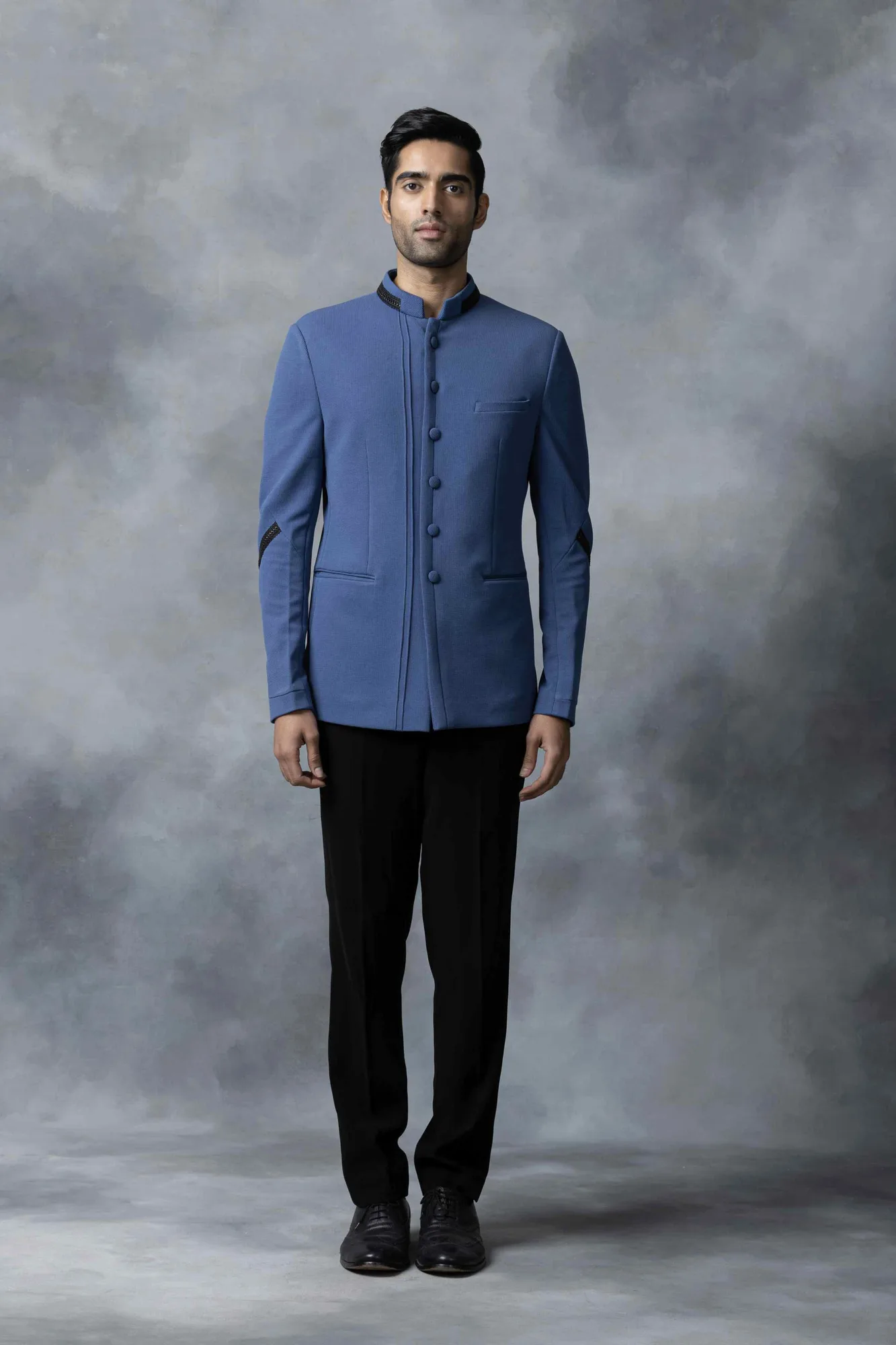 Blue Bandhgala With Black Leather Detailing by Sarab Khanijou