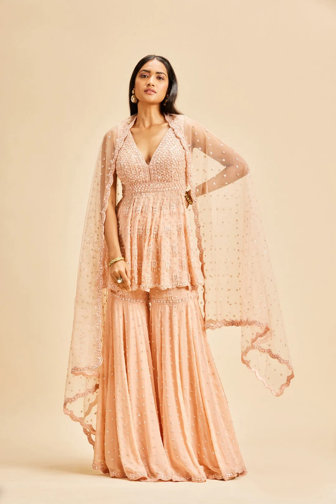 Peach Peplum Garara Set by Nitika Gujral