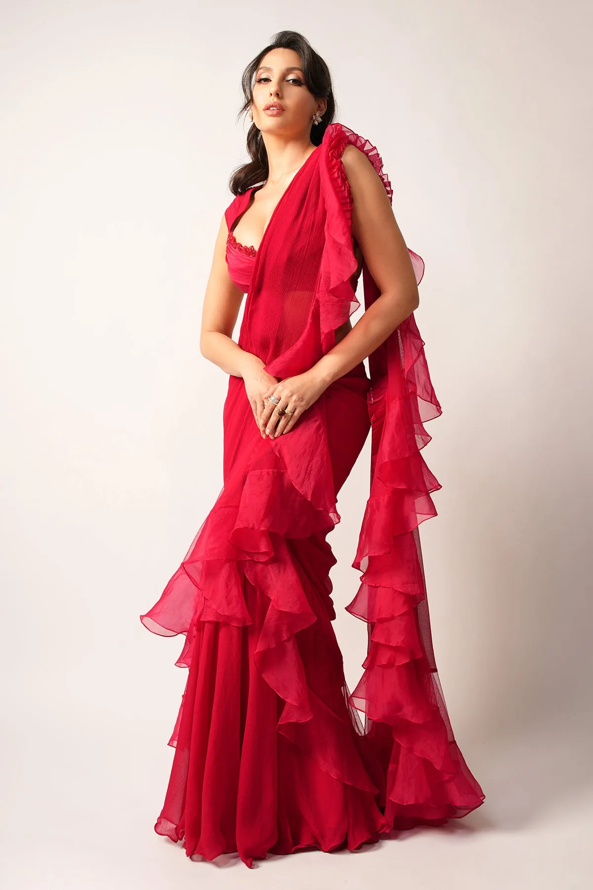Nora Fatehi in Aani by Ridhi Mehra, red sari