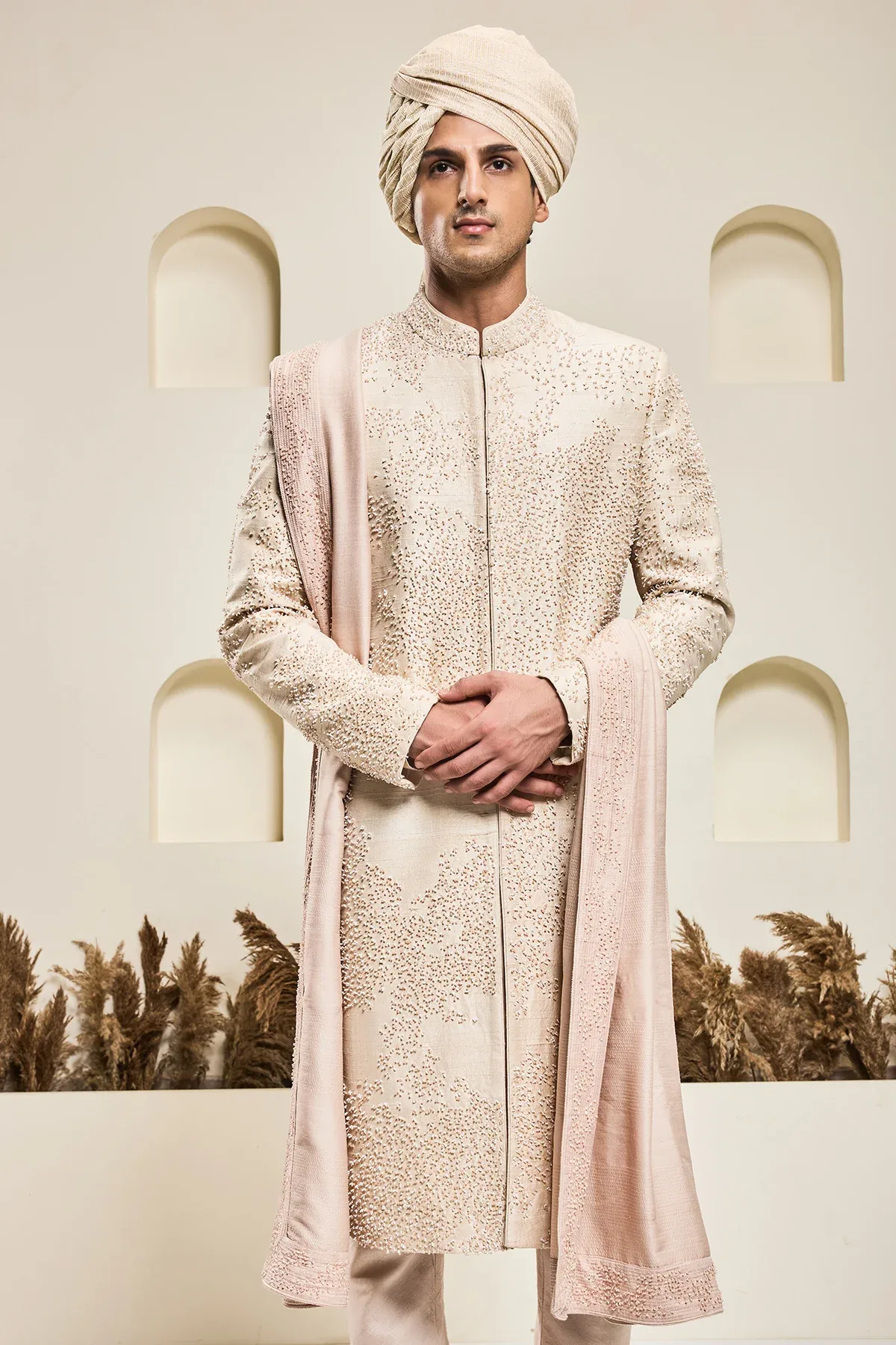 Dusty rose sherwani with pearl and cutdana by Sarab Khanijou