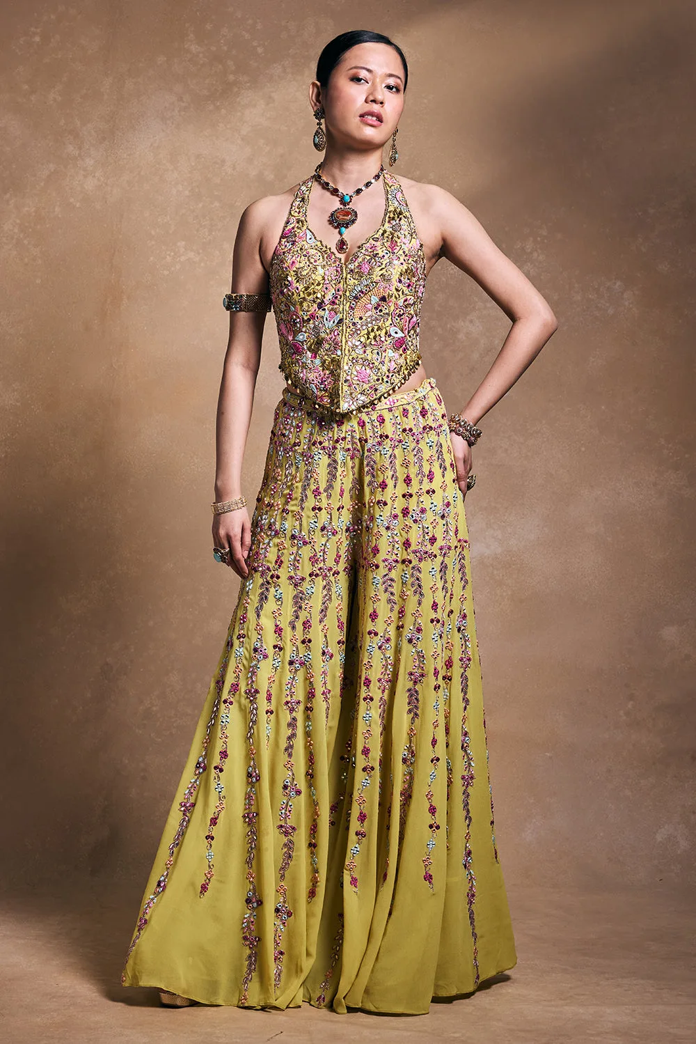 Yellow Georgette High Waist Sharara with Corset by Tamanna Punjabi Kapoor